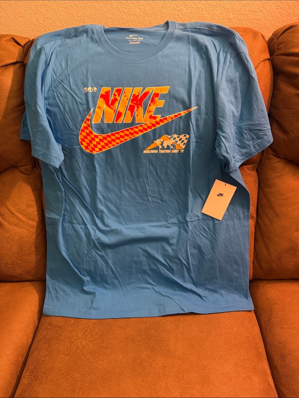Nike Light Blue Tee with Orange-Red Checker Logo